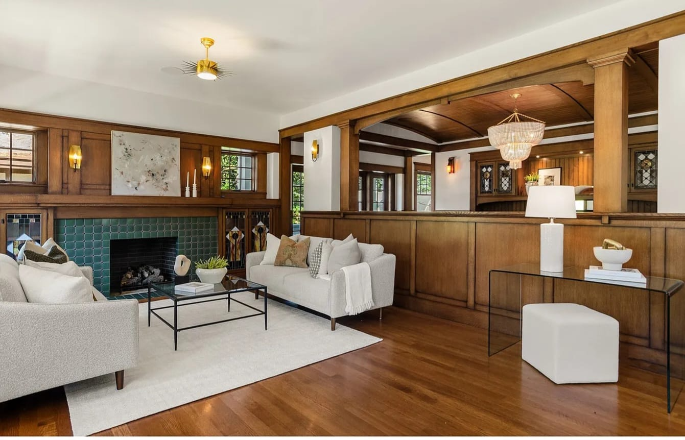 Craftsman-style living room with rich wood paneling, freshly painted ceiling and trim